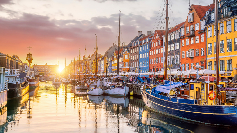 African American traveler enjoying the vibrant streets of Copenhagen, Denmark, a popular and welcoming destination for black travel